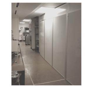 a room with white cabinets and shelves