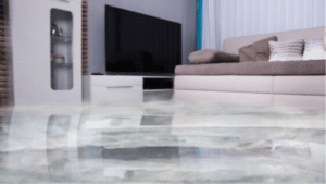 a marble floor with a television in the background