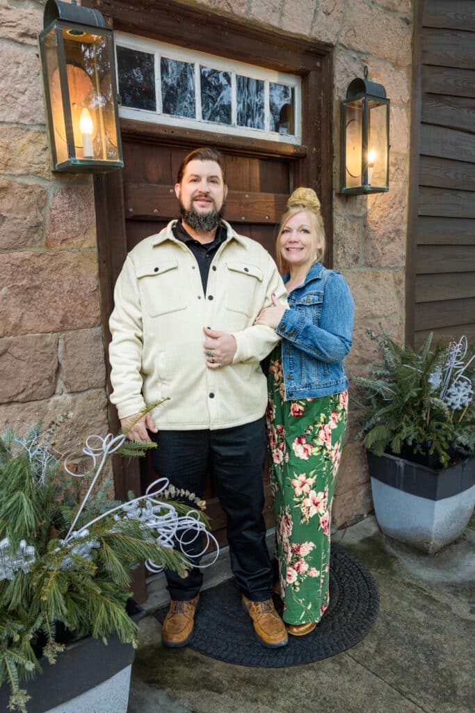 couple standing in front of entrance door
