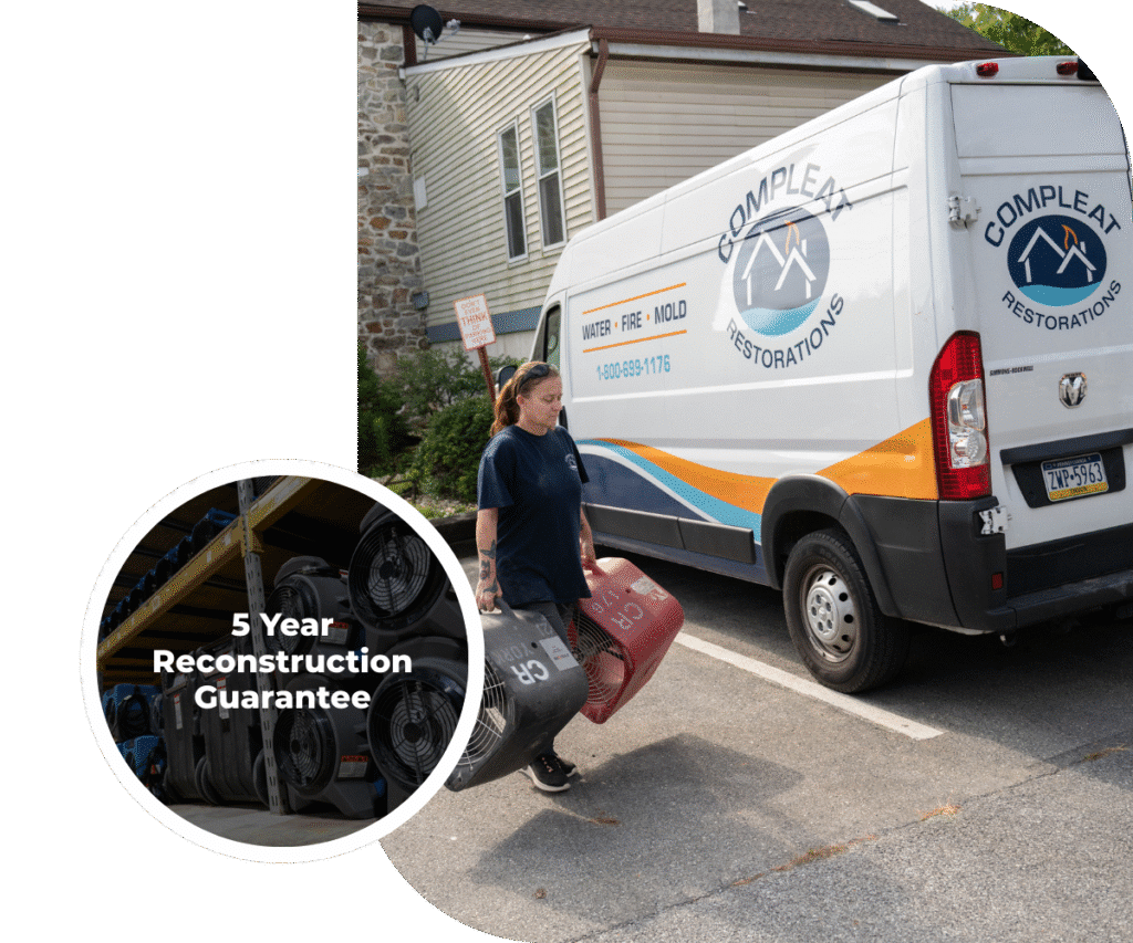 Team member next to a Compleat Restorations van