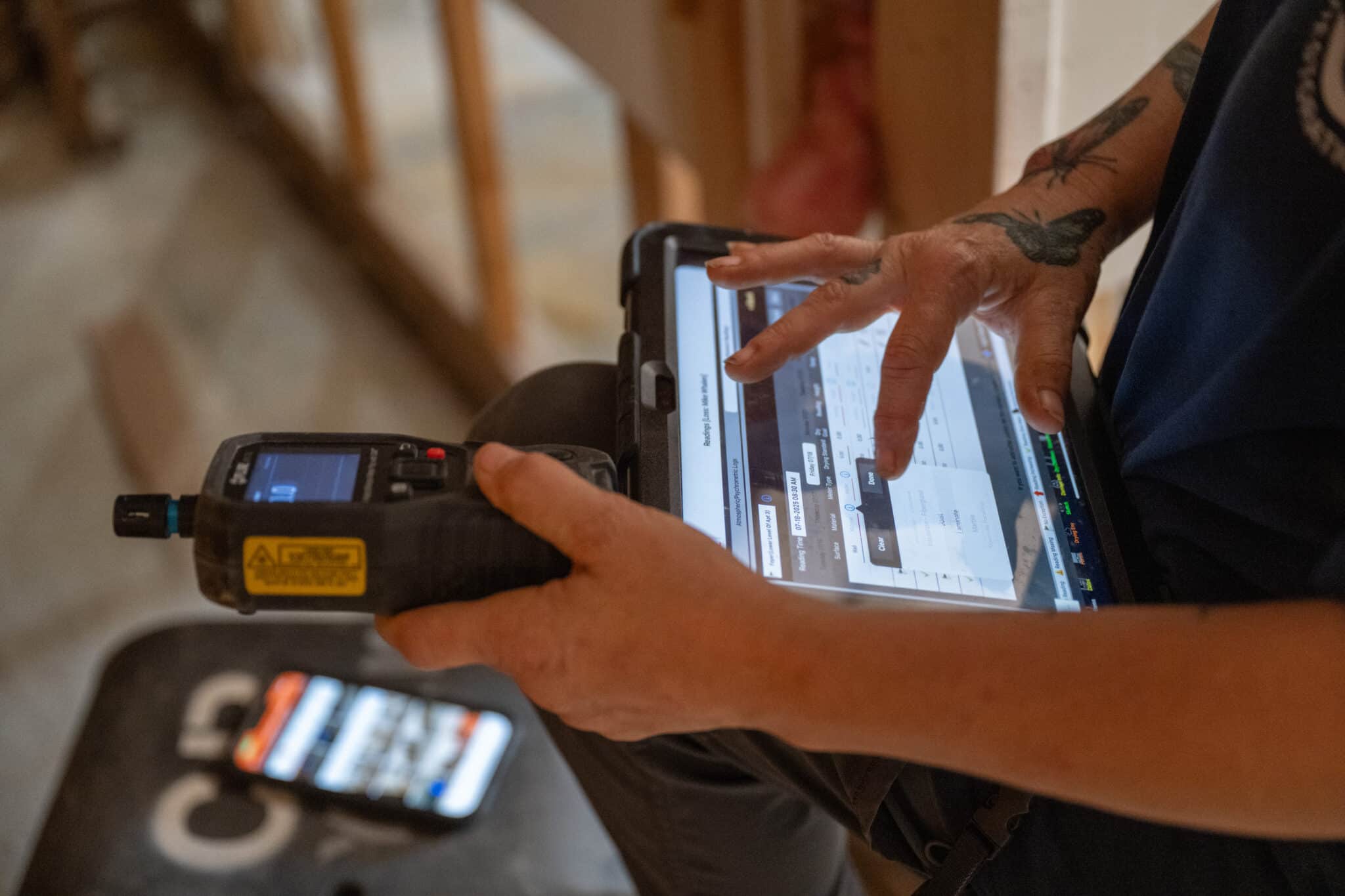 Team member checking moisture