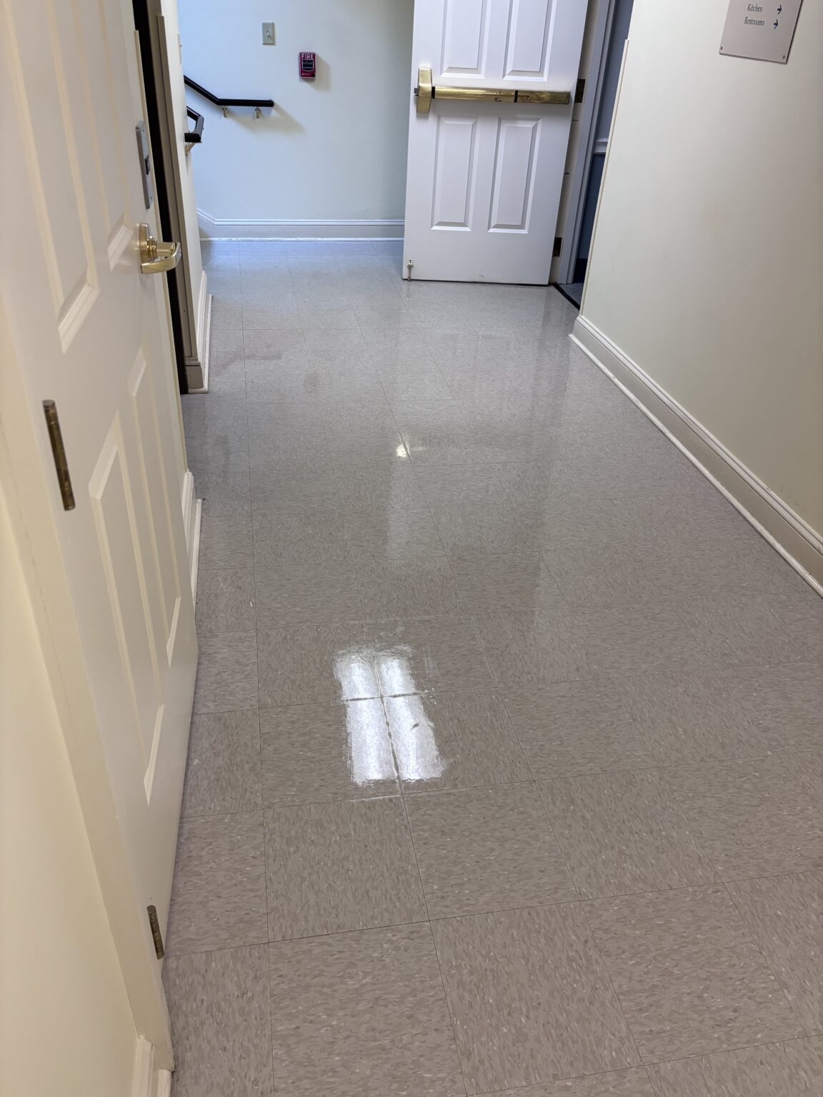 Commercial VCT tile floor after cleaning and polishing by Compleat Clean